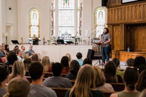 Isaac-Adams-United-We-Pray-speaking-at-an-event